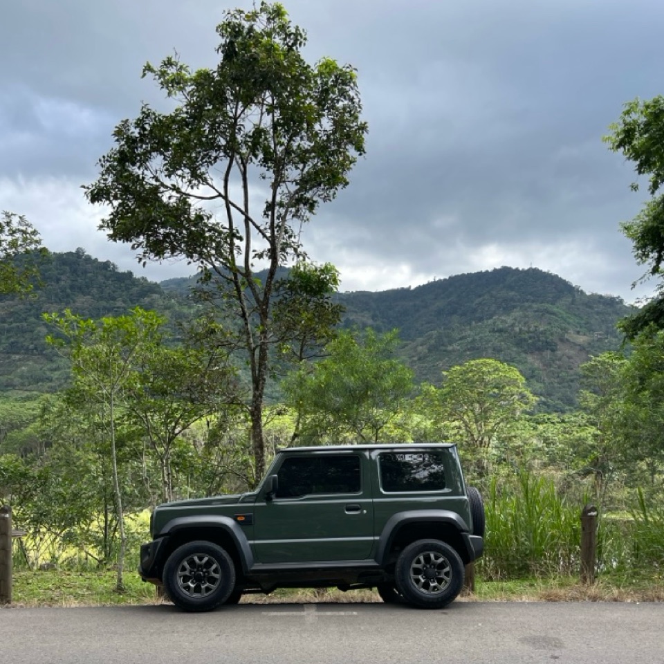 A green 3-door 2023 Suzuki Jimny